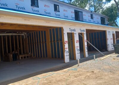 A building under construction with a blue roof, showcasing progress and potential.